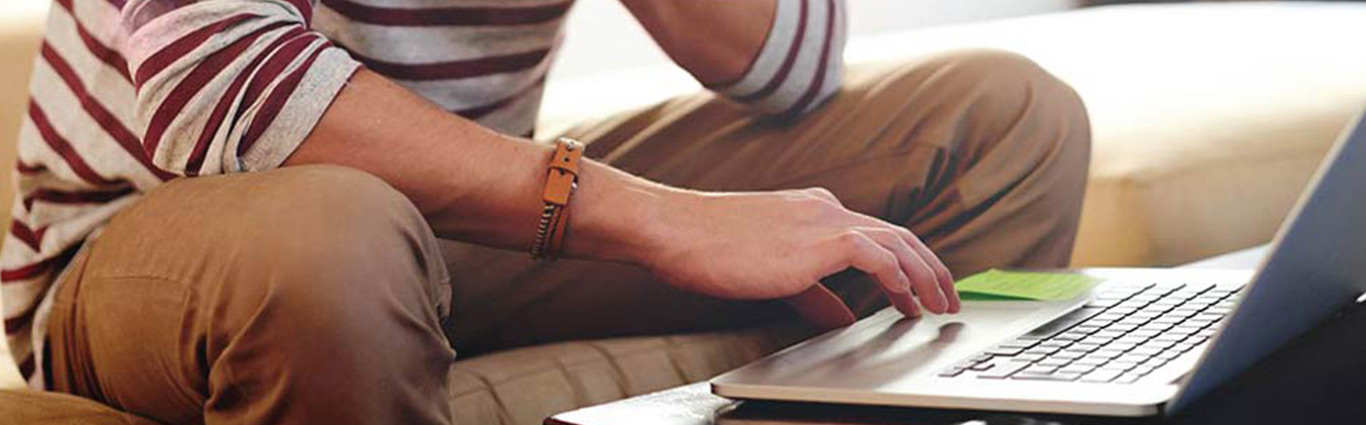 Man using laptop computer.